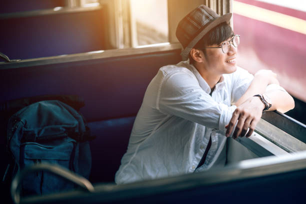 istock Asian man is traveler, he is waiting for their train. 1161200202