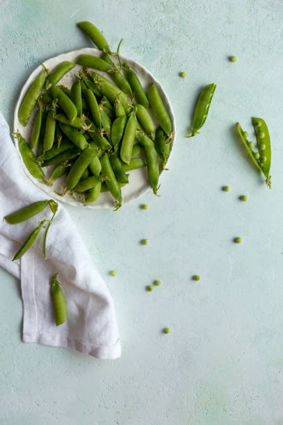 istock Green pea in white bowl with napkin 1161201304