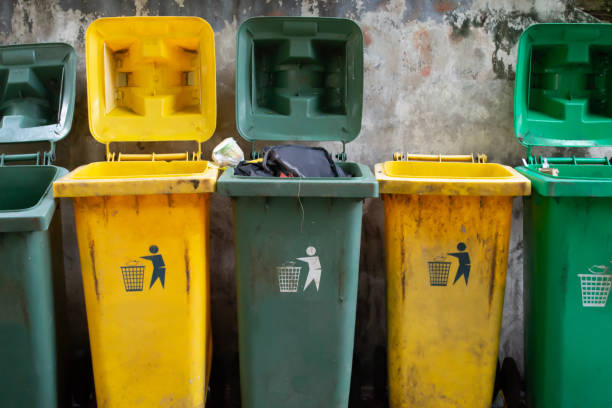 istock dirty green and yellow rubbish bins 1161208350