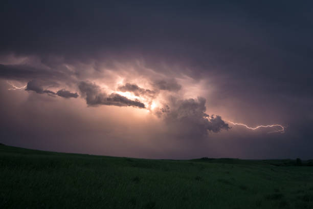 istock Lightning flashes from cloud to cloud in a supercell thunderstorm over the plains of North Dakota 1161209638