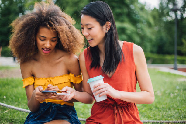 istock Two friends looking at smartphone 1161209858