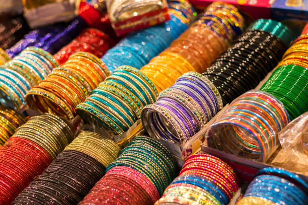 istock Multi-Colored Indian Glass/Metal Bangles Arranged On The Shelf For Sale 1161209997