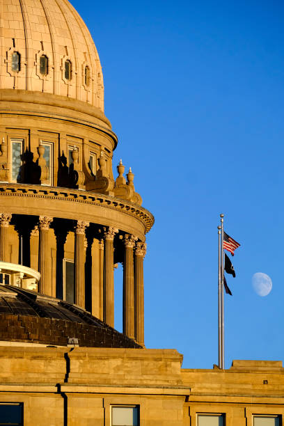 idaho state capitol building governing government dome structure legal laws moon sky flags - idaho state capitol imagens e fotografias de stock