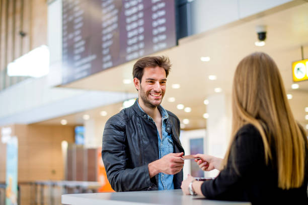 istock Man traveling doing a check-in at the airport 1161211280