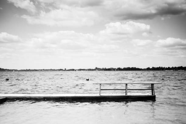 istock Bench on the pier on the lake 1161211454
