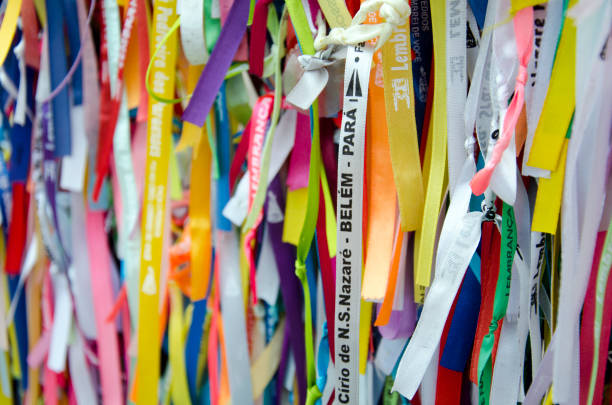 Cirio de Nazaré Religious Ribbons Religious ribbons are hang in front of the Basilica of Our Lady of Nazareth of Exile in Belém do Pará, Brazil. The multi colored ribbons are a nice touch to the front of the Basilica, which has so many faithful coming every year to celebrate the Círio, one of the largest religious festivities. cirio de nazare stock pictures, royalty-free photos & images