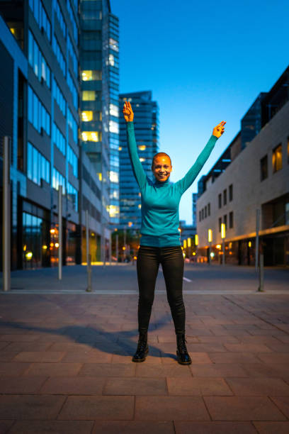 Cheerful woman with short hair, celebrating success stock photo