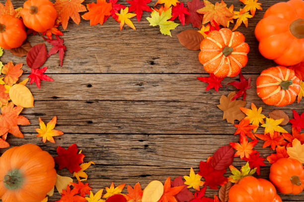 istock Autumn multicolored  leaves and pumpkins old brown wood table background with copy space 1161213109