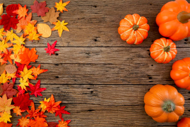 istock Autumn multicolored  leaves and pumpkins old brown wood table background with copy space 1161213111