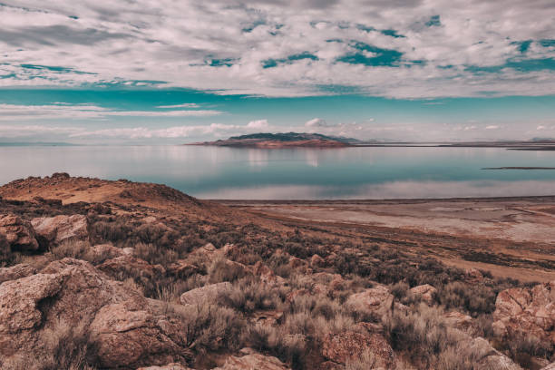 Great Salt Lake, Antelope Island State Park Views of Great Salt Lake on Antelope Island State Park Utah, USA. Desert landscape, water reflections, dramatic clouds. salt flat stock pictures, royalty-free photos & images
