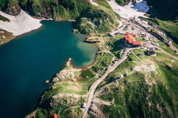 Aerial view Lake Balea on Transfagaras pass in Carpathian mountains Romania Top view Lake Balea on Transfagaras pass in Carpathian mountains Romania balea lake romania stock pictures, royalty-free photos & images