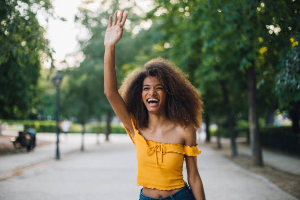 istock Girl raising her hand and smiling 1161216396