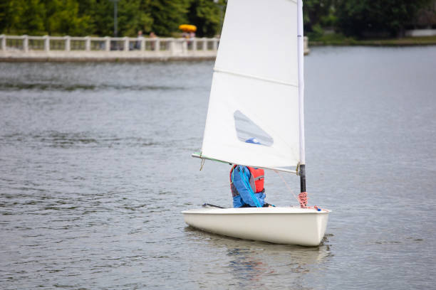 istock single small sailing boat on the lake 1161216768