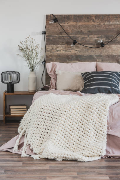 istock Beautiful bedroom interior with king size bed wooden headboard 1161219056