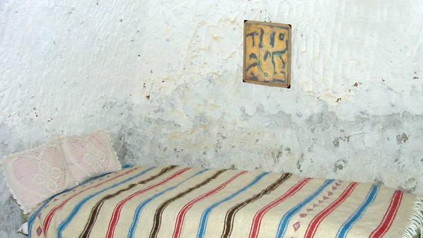 Matmata in the Tunisian desert. People are living in Caves.   They carve their homes in the Desert soil as a protection from the heat.  The painting on the wall is made and added by the photographer.