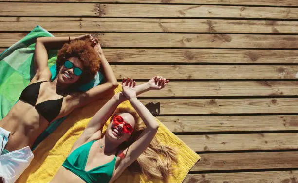 Photo of Women relaxing on beach holiday