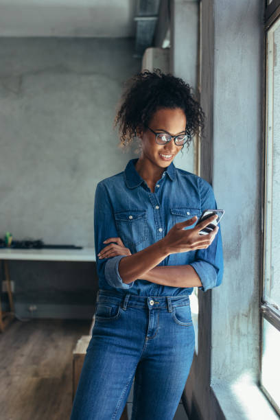 istock Businesswoman in office using a cell phone 1161220831