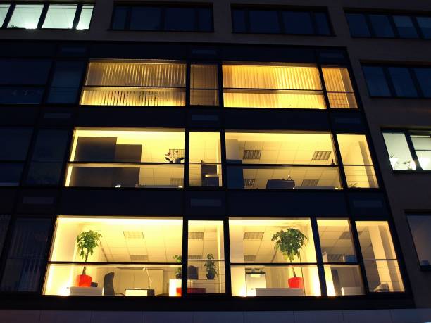 istock Office building at night. Late night at work. 1161220994