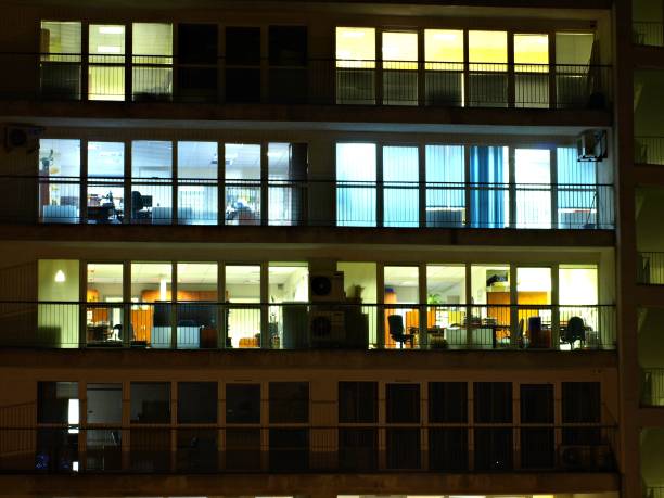 istock Office building at night. Late night at work. 1161221035