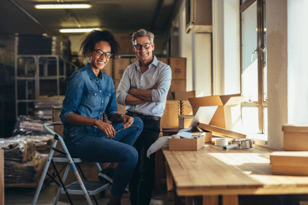 istock Smiling online store business partners 1161221148