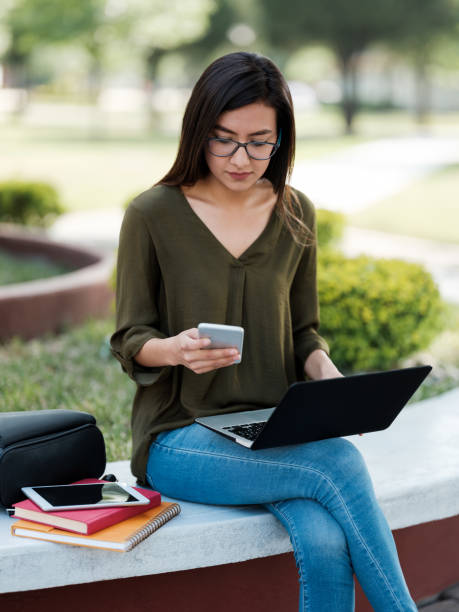 istock College girl checking her smartphone 1161222666