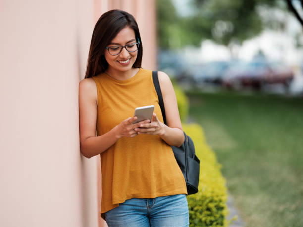istock Latina university student with her cellphone 1161222712