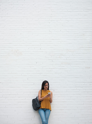 Vertical, Young women, Latin, Smartphone, Texting, Student, Campus, Millennial,
