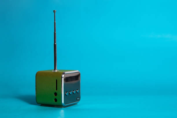 istock Small green radio on a blue background. 1161222849