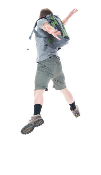 istock Friendly male hiker is jumping with excitement, rear view 1161226455