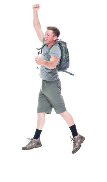 istock Friendly male hiker is jumping with excitement, side view 1161226495
