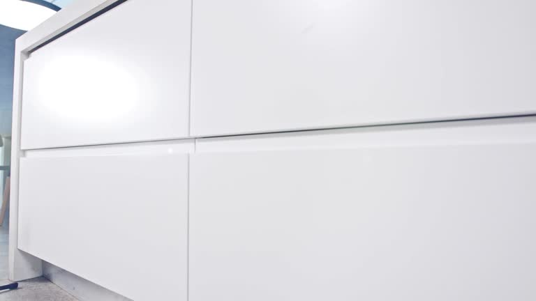 Tracking shot of a large luxury kitchen with white modern design