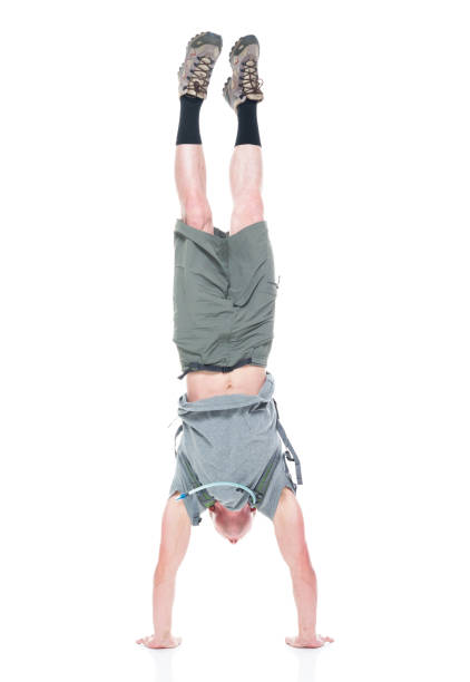 istock Friendly male hiker is doing a handstand 1161226526