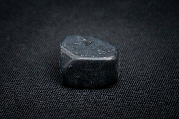 istock Onyx gemstone deep black gem light tones of deep green and blue 1161226558