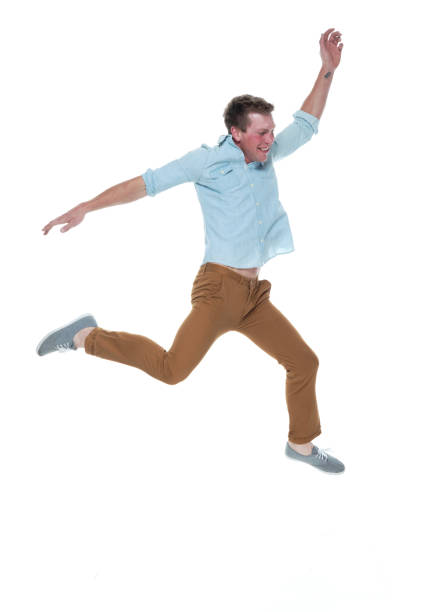istock Casual well dressed man jumping 1161226812