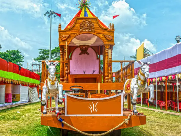 Beautiful wooden Rath or Chariot for Rath Yatra Festival with blue sky in background.