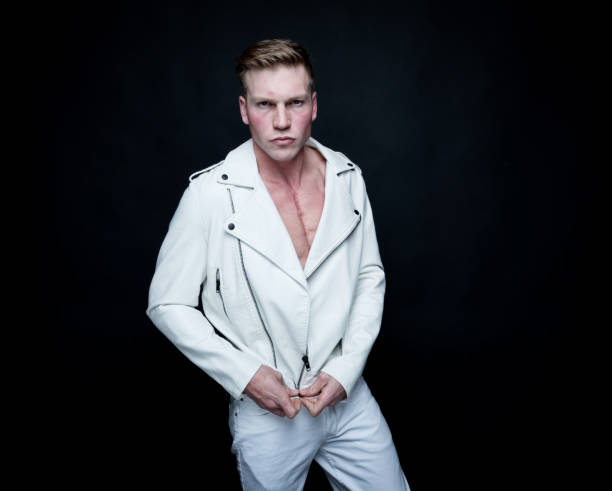 istock Attractive man wearing a white leather jacket 1161227940