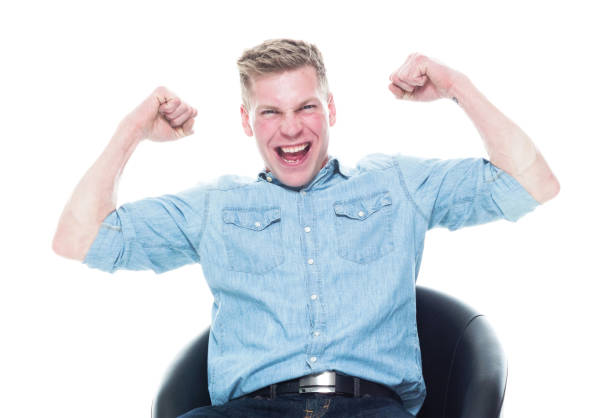 istock Happy seated man doing fist pump 1161229940