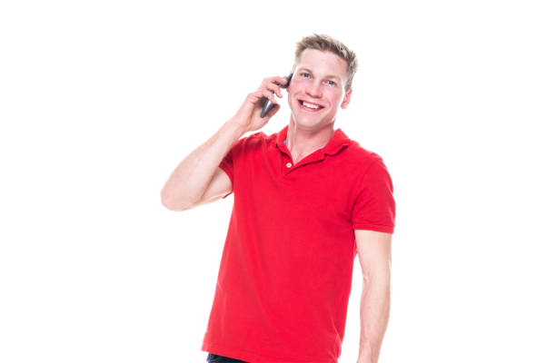 A Japanese man opens a large volume and is happily talking on a mobile phone. The outdoors is bright sunshine and he looks very happy. Are you talking to her? Do you hear the happy news from your friends?