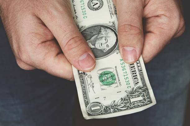 istock Man holding money in his hands. 1161231742