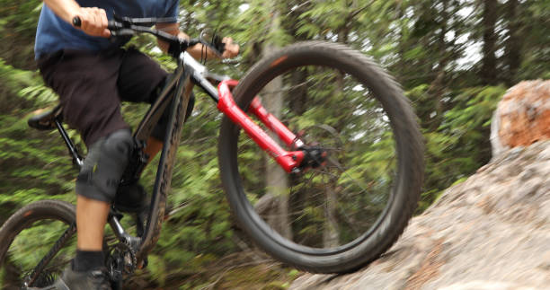 istock Mountain biker ascends steep rock slab 1161241562
