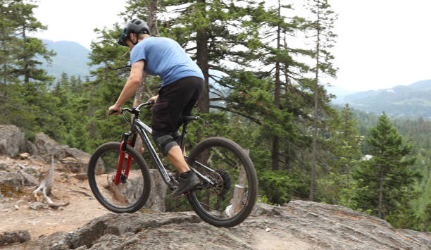 istock Mountain biker ascends steep rock slab 1161241571
