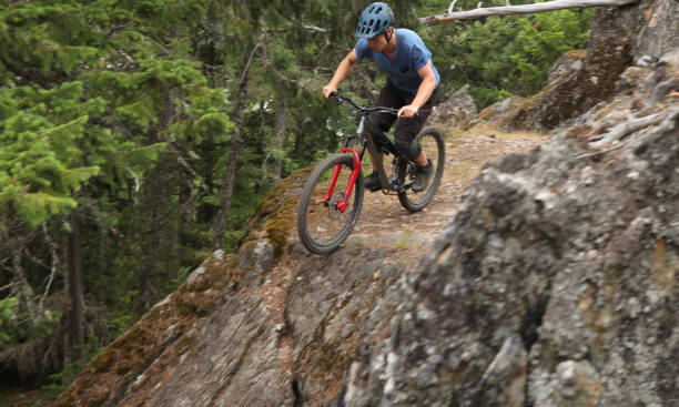 istock Mountain biker rides down steep rock slab 1161241572