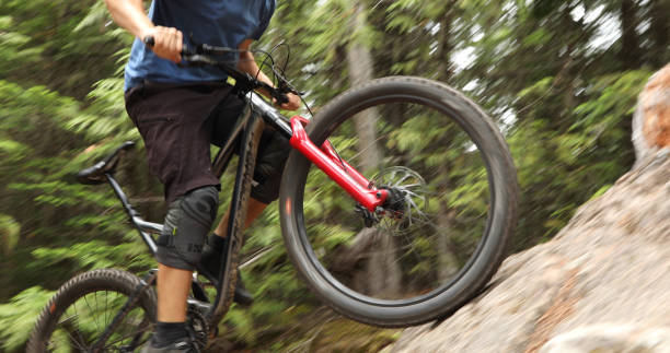 istock Mountain biker ascends steep rock slab 1161241575