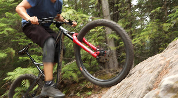 istock Mountain biker ascends steep rock slab 1161241602