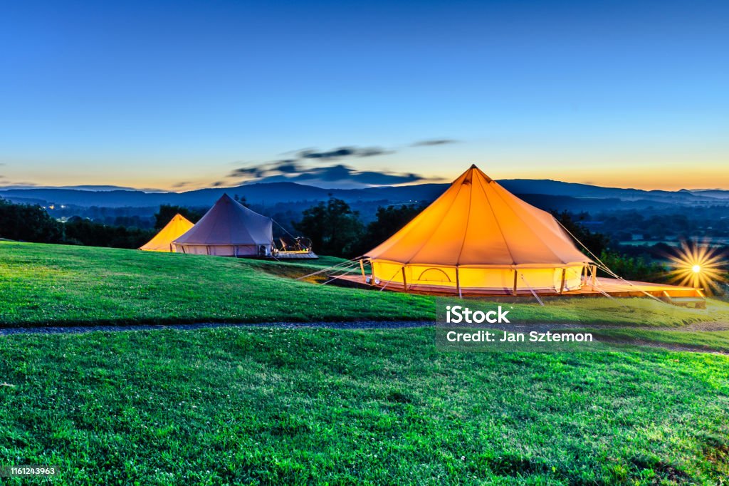 Glamping Picture of tents in camp during the sunset Glamping Stock Photo