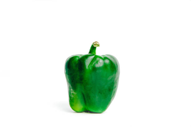 Green pepper ready to cook. Peppers lie on a countertop, the concept of cooking and preparing a meal.