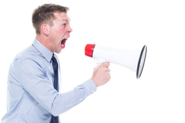 istock Handsome caucasian businessman in nice clothing - using a megaphone 1161244887