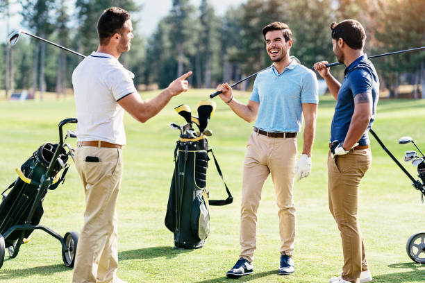istock Golfer friends in discussion on the field 1161248282