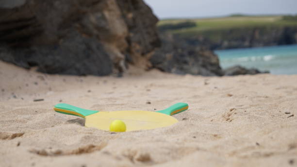 istock Bat and ball abandoned on a sandy beach in Harlyn Bay, Cornwall. 1161253002