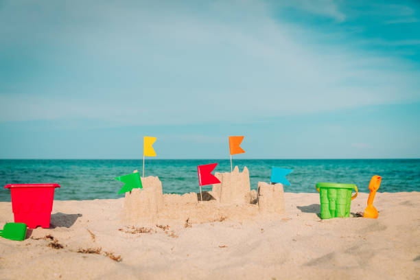 istock Sand castle on beach vacation and toys 1161253886